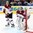 MINSK, BELARUS - MAY 17: Latvia's Kristers Gudlevskis #50 and Kristaps Sotnieks #11 look on during preliminary round action against Russia at the 2014 IIHF Ice Hockey World Championship. (Photo by Andre Ringuette/HHOF-IIHF Images)


